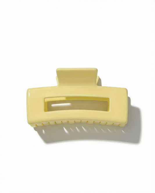 Yellow hair clip on a white background