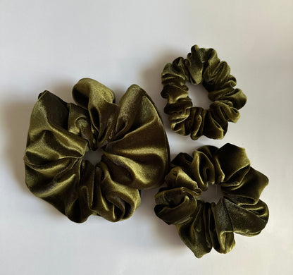Green velvet scrunchies in different sizes 
